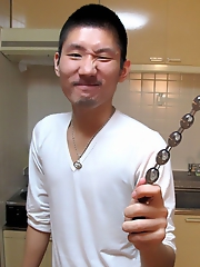 Cute asian boy jerks off and plays with dildo.